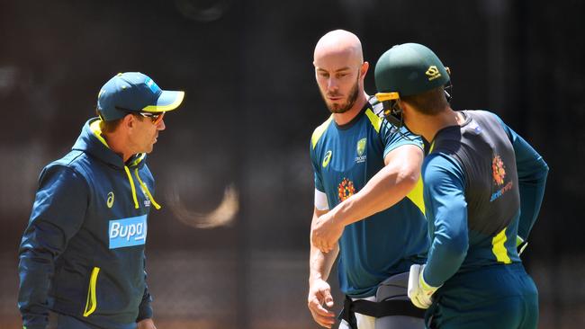 Justin Langer, Chris Lynn and Alex Carey talk technique. Picture: Getty