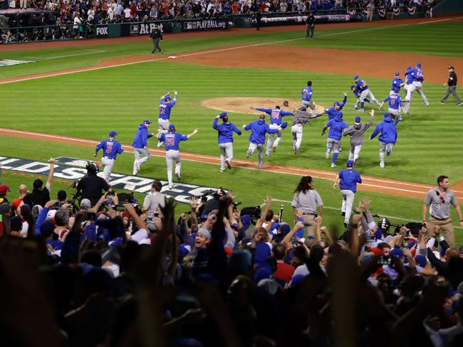 The Chicago Cubs celebrate after defeating the Cleveland Indians in Game 7.