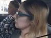 Mum accused of bizarre love triangle kill plot lands back in Australia