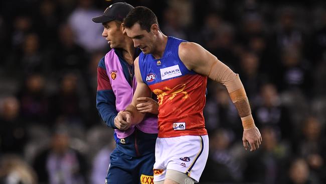 Darcy Gardiner is helped from the field.