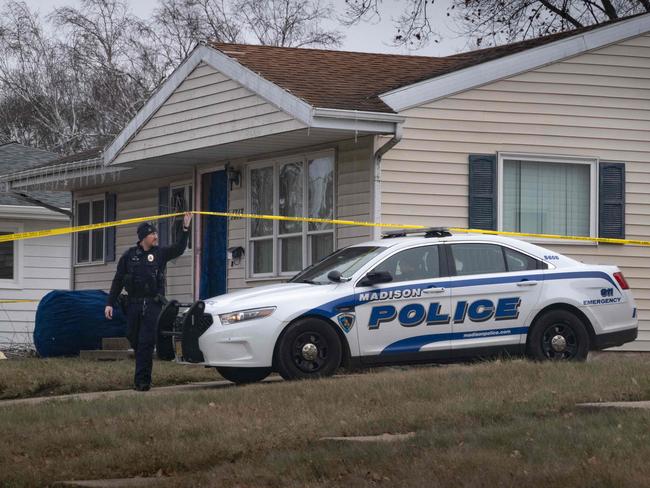 Police stand guard outside the home of 15-year-old Natalie Rupnow. Picture: Getty Images via AFP