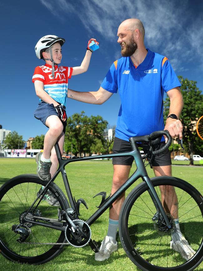 Max Gawn alongside seven-year-old Paddy Crowe. The Melbourne captain has been announced as the Tour Down Under’s ambassador for the 2023 race. Picture Dean Martin