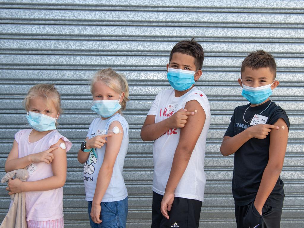 Evie, 5, and Olivia, 7, Kurz with Louie, 9, and Harry, 11, Taylor-Bishop after receiving their Covid jab. Picture: Brad Fleet