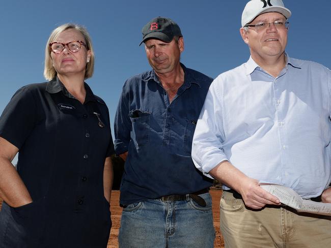 Prime Minister Scott Morrison with sheep and cattle graziers Stephen and Annabel Tully at the Tully property in Quilpie, during the Prime Minister's drought tour in South West Queensland. Picture: Alex Ellinghausen