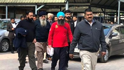 Rajwinder Singh, in red, leaving court in India last week. Picture: Tawqeer Hussain