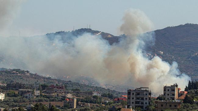 Smoke billows from a site targeted by the Israeli military in the southern Lebanese border village of Kafr Kila. Picture: AFP.