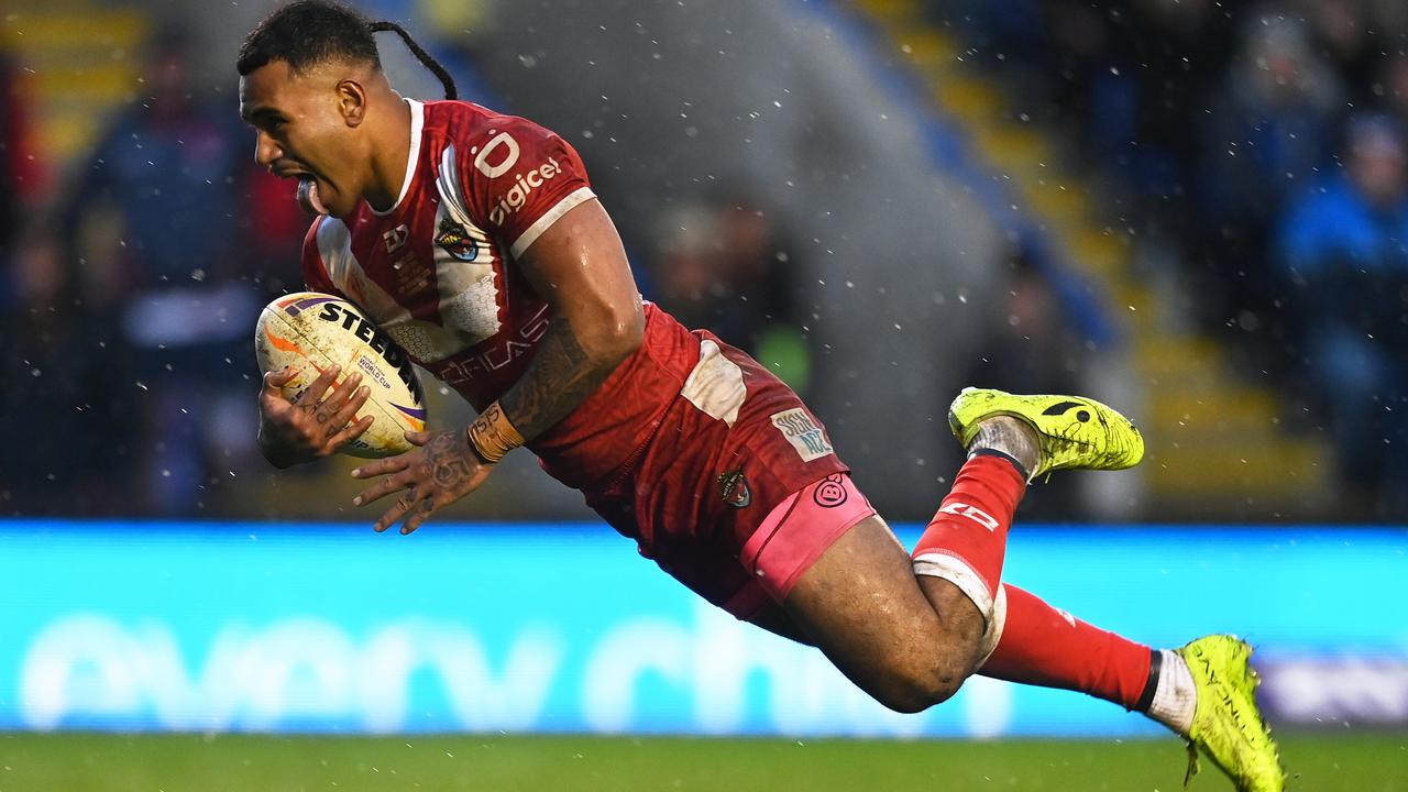 Sione Katoa of Tonga goes over to score his side’s third try during the Rugby League World Cup Quarter Final match between Tonga and Samoa. Picture: Gareth Copley/Getty Images