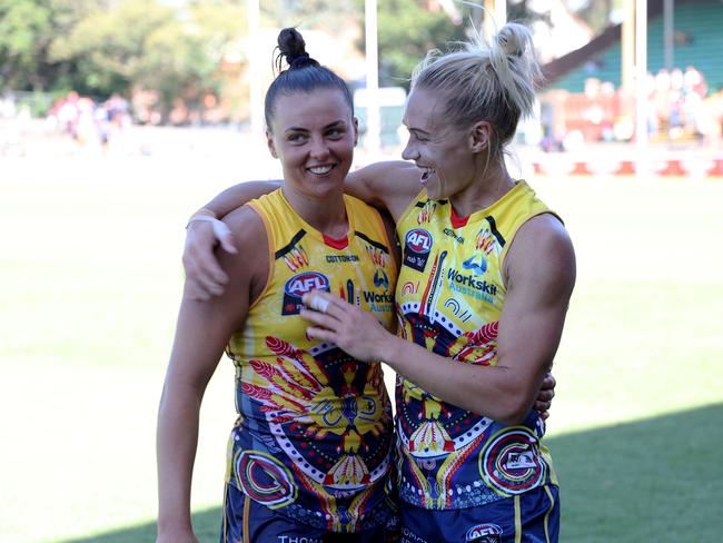 Phillips with teammate Ebony Marinoff after a thrilling win over Collingwood earlier this month. Picture: James Elsby/AFL Photos via Getty Images