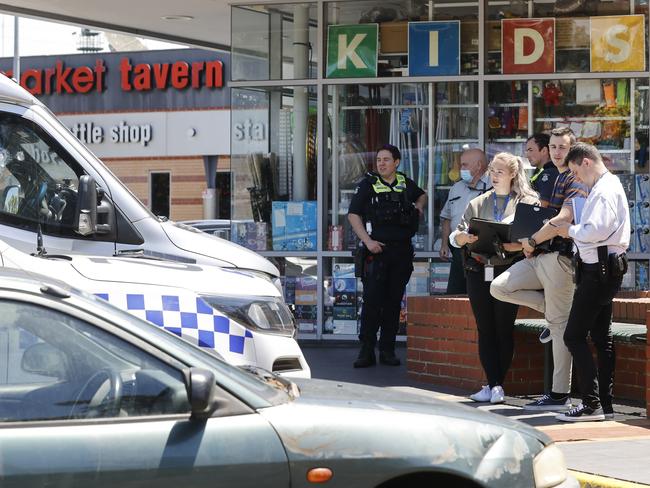 Police inspect the damaging following an alleged road rage incident in Flemington. Picture: Alex Coppel.