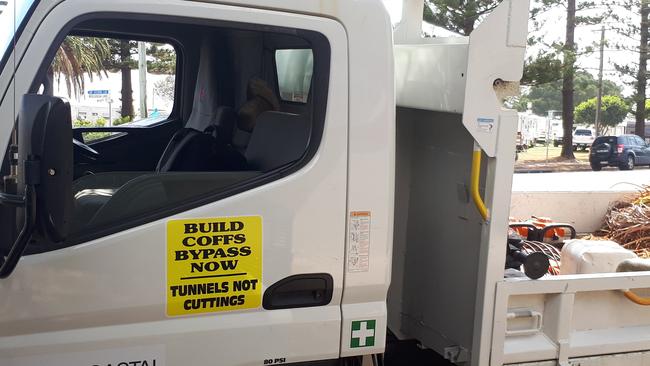 Coffs Harbour City Council's vehicle fleet was fitted with stickers calling for tunnels on the Coffs bypass and not cuttings and landbridges.