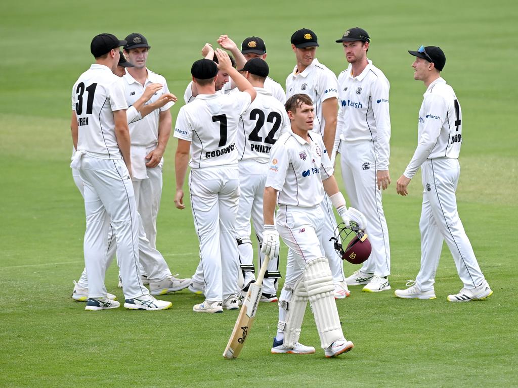 Marnus Labuschagne walks off as WA players celebrate the wicket of the Test star. Picture: Bradley Kanaris/Getty Images