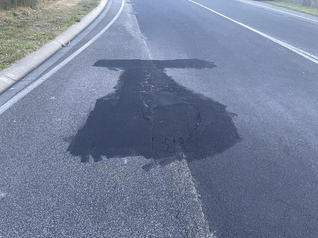 The pothole has since been repaired and the graffiti was removed. Picture: Jack Colantuono