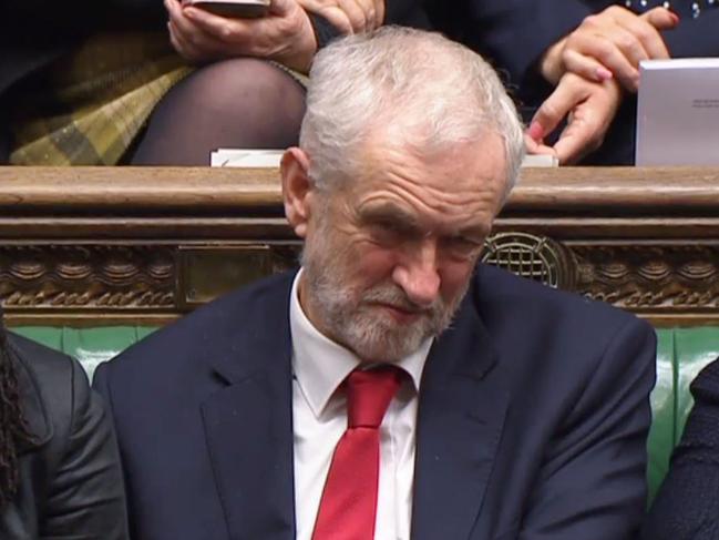 A video grab from footage broadcast by the UK Parliament's Parliamentary Recording Unit (PRU) shows British opposition leader Jeremy Corbyn listening as a point of order is raised by a member in the House of Commons in London on December 19, 2018 following an allegation that British opposition leader Jeremy Corbyn muttered the words "stupid woman" in the House. - British opposition leader Jeremy Corbyn faced calls to apologise on Wednesday after being accused of muttering "stupid woman" at Prime Minister Theresa May during a heated exchange over her delaying tactics on Brexit. (Photo by HO / PRU / AFP) / RESTRICTED TO EDITORIAL USE - MANDATORY CREDIT " AFP PHOTO / PRU " - NO USE FOR ENTERTAINMENT, SATIRICAL, MARKETING OR ADVERTISING CAMPAIGNS