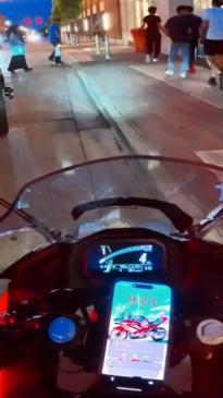 Wholesome moment motorcyclist checks with police if kid can rev his bike