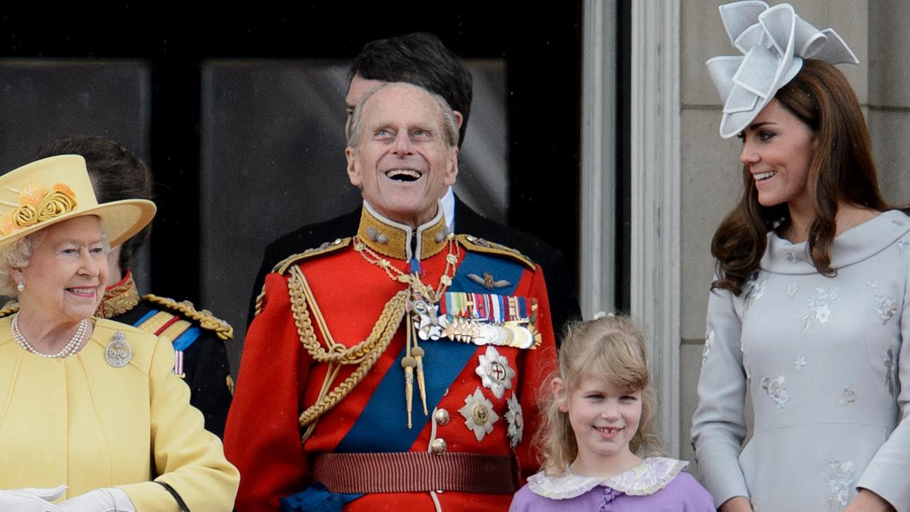 Queen Elizabeth, Prince Philip, Lady Louise Windsor and Catherine, Duchess of Cambridge share a laugh on Buckingham Palace’s balcony in 2012. Picture: Leon Neal/AFP