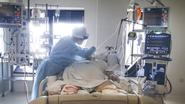 ICU nurse Chelsea Wong caring for a COVID patient. Picture: David Caird