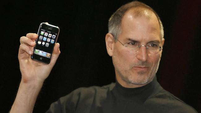 Steve Jobs unveils the iPhone in 2007. The device has helped the company deliver shareholder returns over the past 20 years totalling 45,155 per cent. Picture: AFP