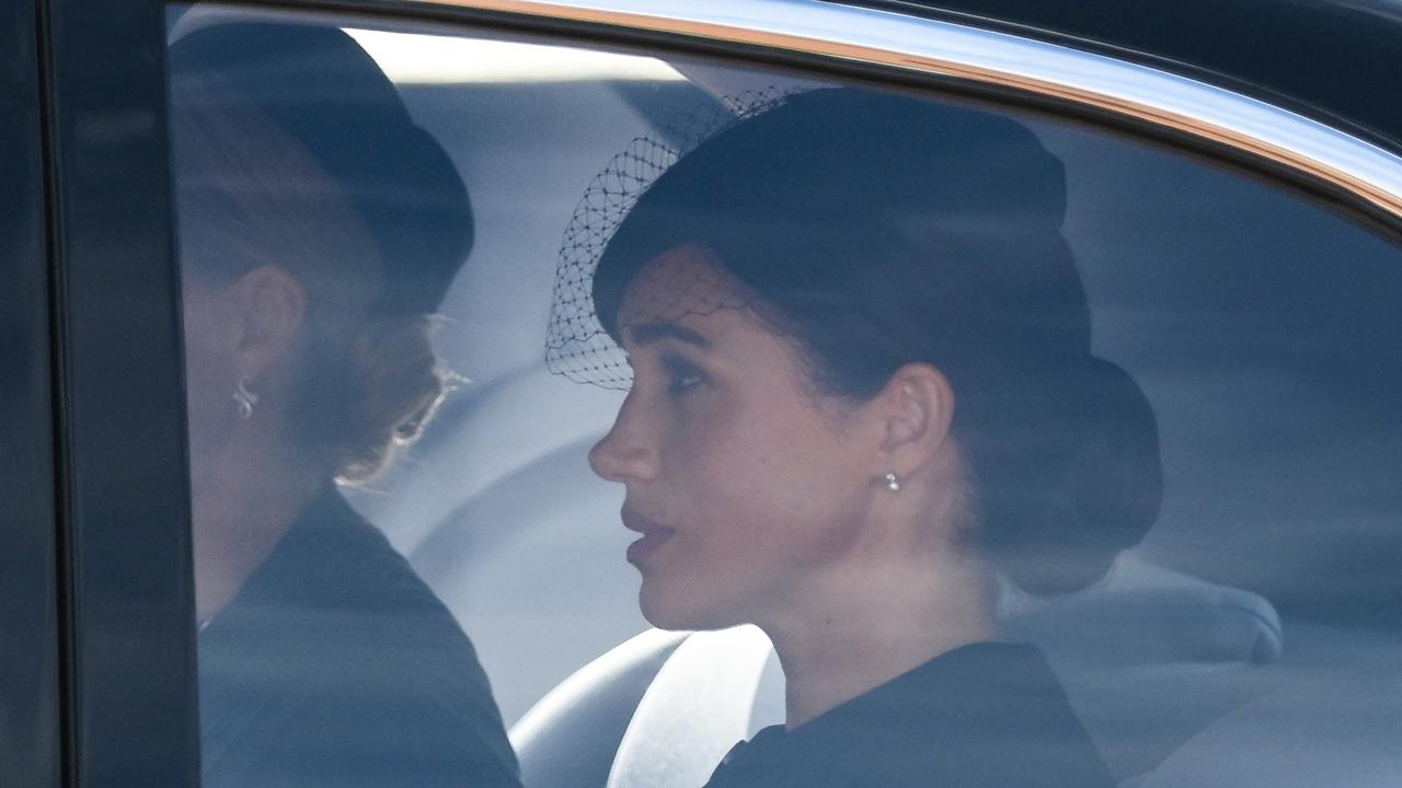 Meghan, Duchess of Sussex, is driven behind the coffin of Queen Elizabeth II, alongside Sophie, Countess of Wessex (Photo by Daniel LEAL / POOL / AFP)