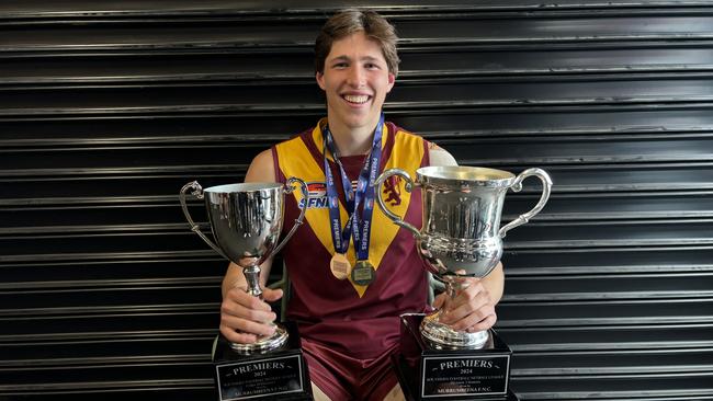 Blake Meadows holds his two cups.