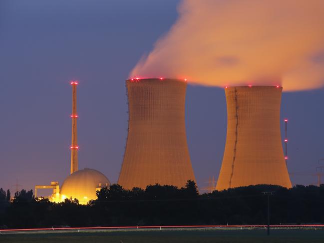 GRAFENRHEINFELD, GERMANY - JUNE 11:  Passing cars leave a streak of light as steam rises from the cooling towers of the Grafenrheinfeld nuclear power plant at night on June 11, 2015 near Grafenrheinfeld, Germany. The Grafenrheinfeld plant, which is owned by German utilitiy E.ON and has been in operation since 1981, is scheduled to cease operation later this month on June 27. Germany is withdrawing itself from nuclear energy reliance and has established ambitious goals for increasing its capacity of renewable energy sources.  (Photo by Sean Gallup/Getty Images)