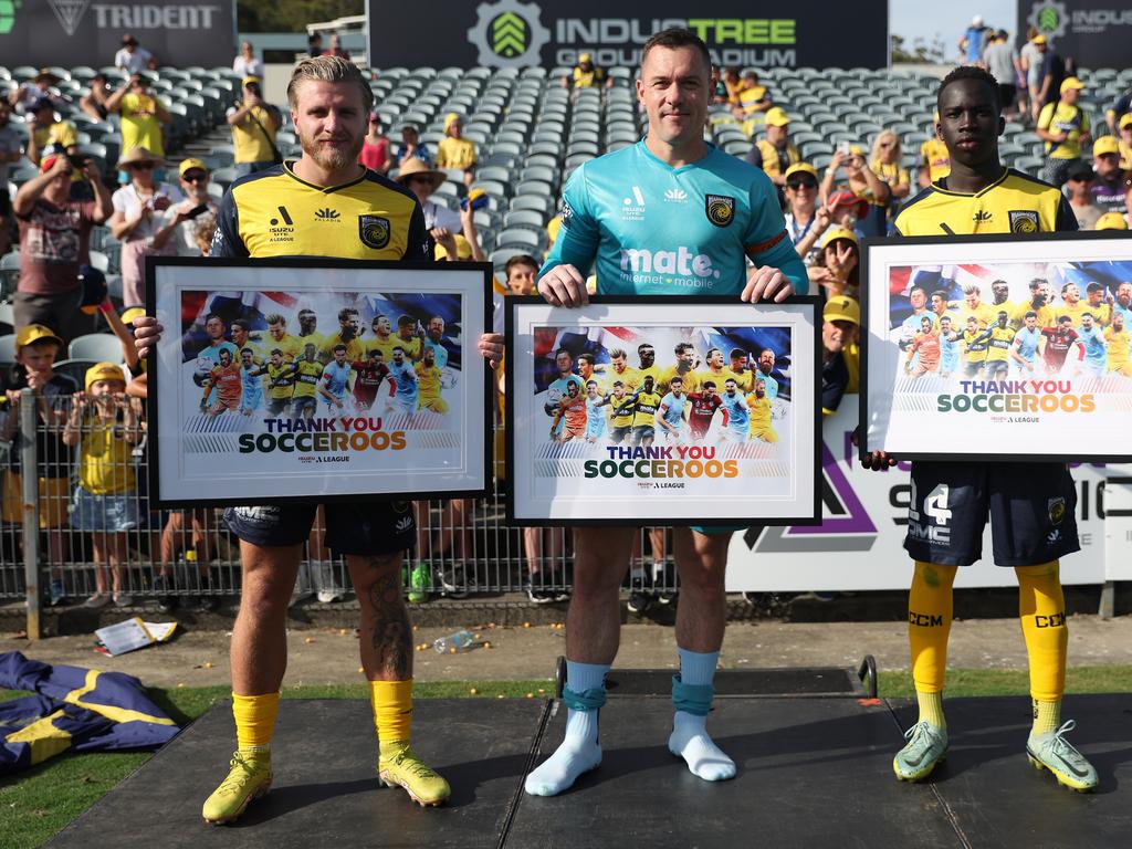 Mariners trio (from left) Jason Cummings, Danny Vukovic, and Garang Kuol are honoured for being a part of Australia’s World Cup squad in Qatar. Picture: Scott Gardiner/Getty Images