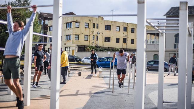 People are seen working out at Bondi Beach. Picture: Flavio Brancaleone