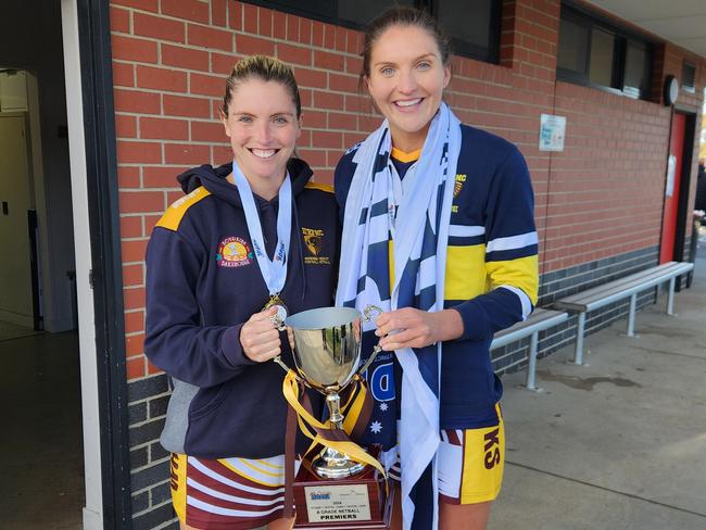 Sam Coppinger and Tayissa Coppinger with the A-Grade premiership cup and flag.