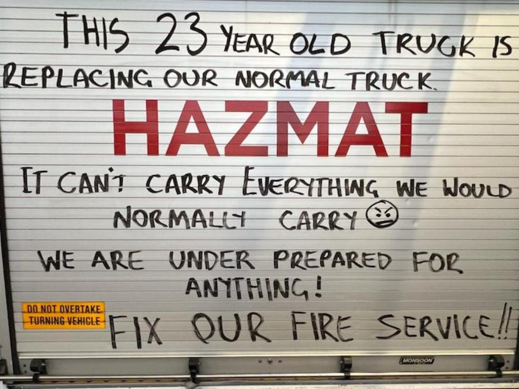 A plea from firefighters on the back of a fire truck Picture: Fire Brigade Employees Union of NSW