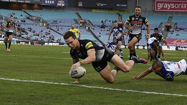 Dylan Edwards of the Panthers scores a try.