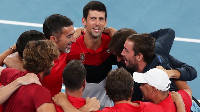 Novak Djokovic celebrates his semi-final win with the Serbian team. Picture: Getty Images