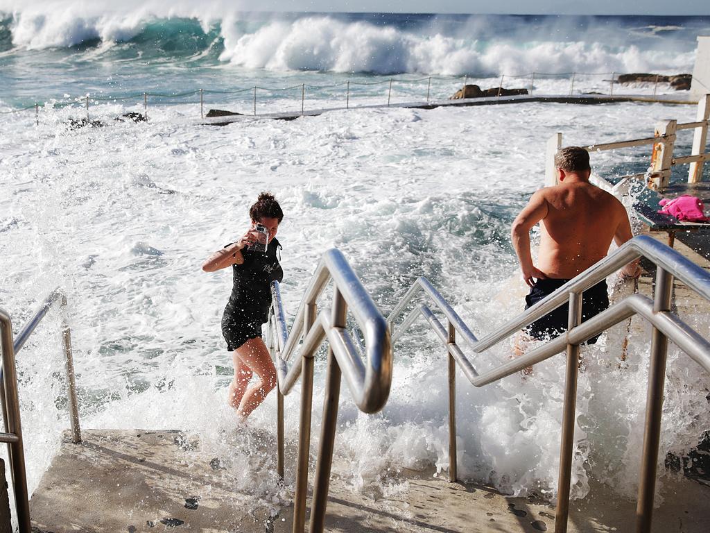 Swimmers have fun with the large swell at Bronte Beach. Picture: Daniel Aarons