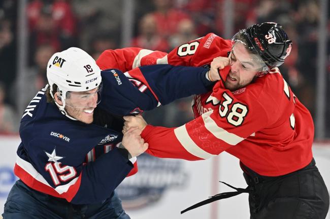 Team USA's Matthew Tkachuk, left, fights Canada's Brandon Hagel early in the first period of the Americans' 3-1 win over Canada at Montreal, with a rematch set for Thursday's Four Nations Face-Off final at Boston