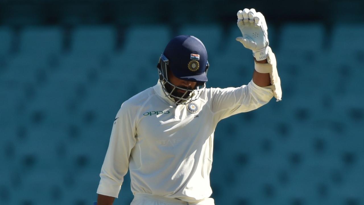 India's Murali Vijay waves to the crowd after he scored a century on the fourth day of the tour match against Cricket Australia XI at the SCG.