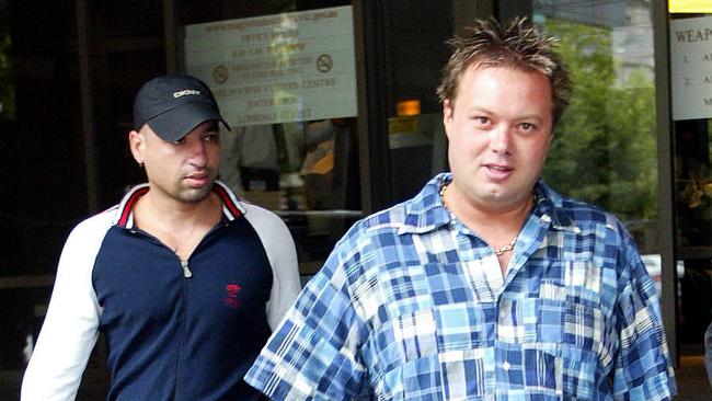 Carl Williams with Andrew Veniamin outside the Melbourne Magistrates Court in 2004.