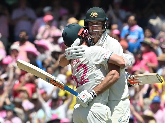 Australiaâs Travis Head and Beau Webster (R) celebrate victory against India in the fifth and final cricket Test match at the Sydney Cricket Ground on January 5, 2025. (Photo by Saeed KHAN / AFP) / -- IMAGE RESTRICTED TO EDITORIAL USE - STRICTLY NO COMMERCIAL USE --