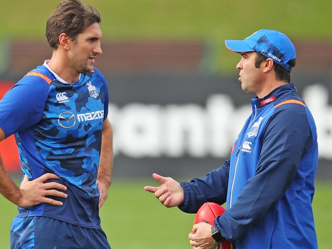 MELBOURNE, AUSTRALIA - MAY 16:  Brad Scott, coach of the Kangaroos speaks to Jarrad Waite of the Kangaroos during a North Melbourne Kangaroos AFL training session at Arden Street Ground on May 16, 2018 in Melbourne, Australia.  (Photo by Scott Barbour/Getty Images)