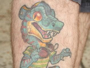 Paul Briske's tattoo of a velociraptor dressed as The Fresh Prince of Bel-Air. Picture: Eugene Bo Paul Briske's tattoo of a velociraptor dressed as The Fresh Prince ofBel-Air. Picture: Eugene Boisvert