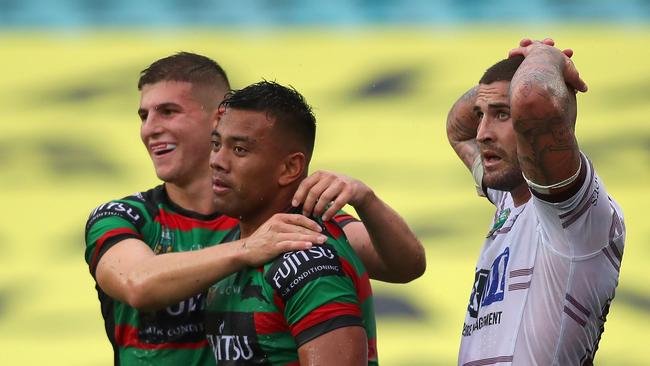 SYDNEY, AUSTRALIA — MARCH 24: Richie Kennar of the Rabbitohs (C) celebrates a try with a team mate during the round three NRL match between the South Sydney Rabbitohs and the Manly Sea Eagles at ANZ Stadium on March 24, 2018 in Sydney, Australia. (Photo by Tony Feder/Getty Images)