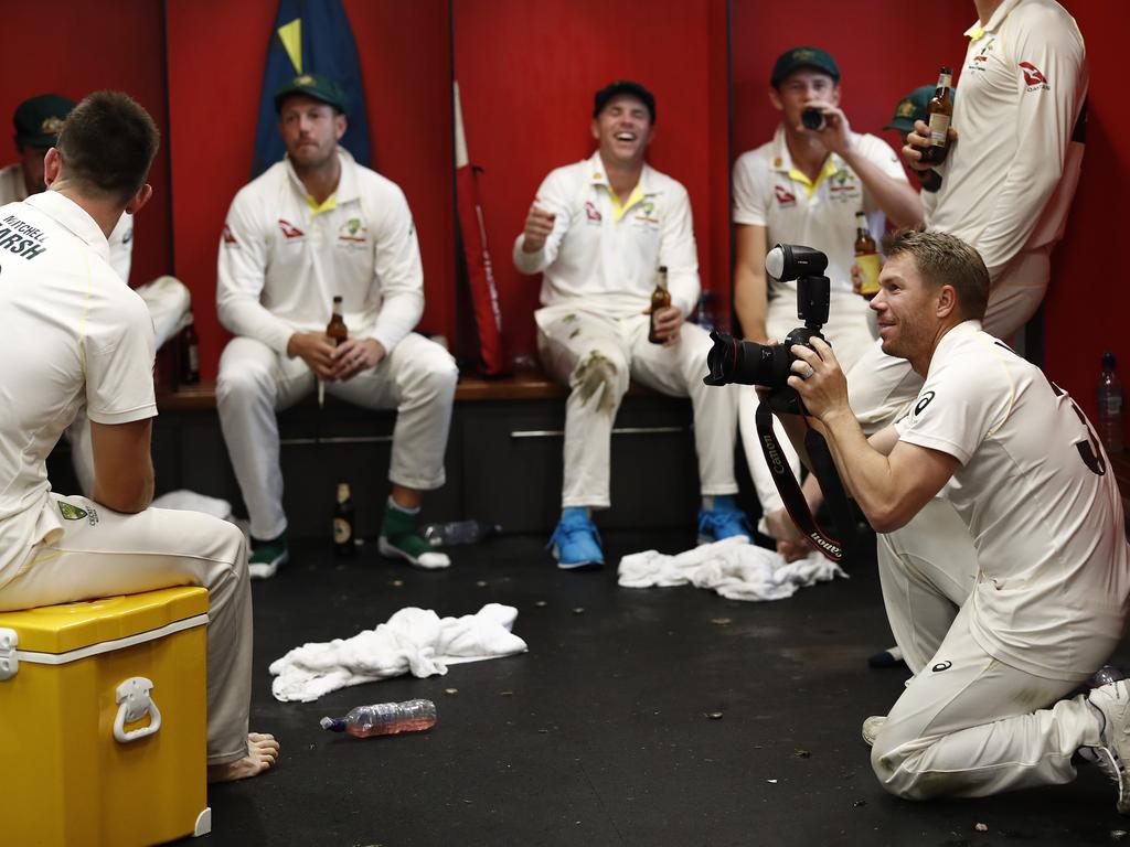 MANCHESTER, ENGLAND - SEPTEMBER 08: David Warner of Australia takes photos in the change rooms after Australia claimed victory to retain the Ashes during day five of the 4th Specsavers Test between England and Australia at Old Trafford on September 08, 2019 in Manchester, England. (Photo by Ryan Pierse/Getty Images)