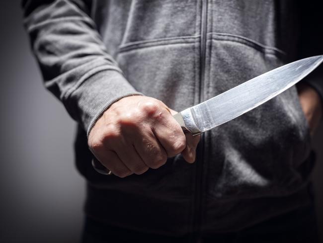 Generic crime Istock  -  Criminal with knife weapon threatening to stab