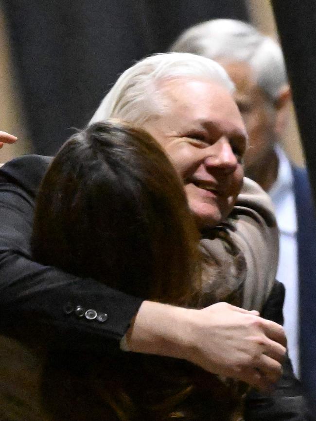 Assange is greeted by wife Stella at Canberra Airport. Picture: AFP