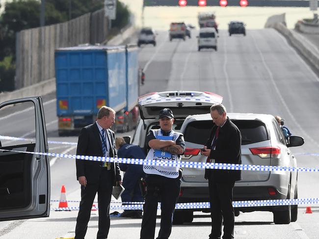 Victorian Police officers attend the scene of a shooting along the Monash Freeway in Melbourne, Thursday, May 28, 2020. An armed man has been shot dead by police following a stand-off on a busy Melbourne freeway. (AAP Image/James Ross) NO ARCHIVING