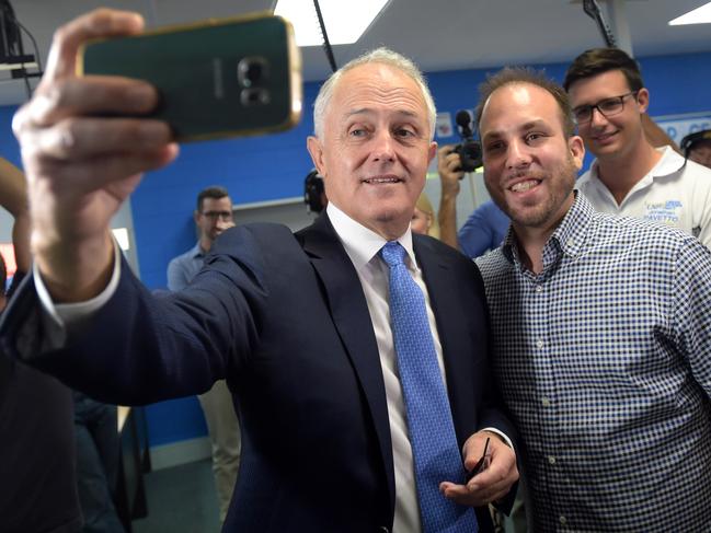 Australian Prime Minister Malcolm Turnbull takes a selfie during a visit to the innovation hub ‘The Space’ in the federal seat of Leichhardt in Cairns. Mr Turnbull will take his innovation drive to the nation’s north with a $30 million jobs and investment package for Cairns. (AAP Image/Lukas Coch)