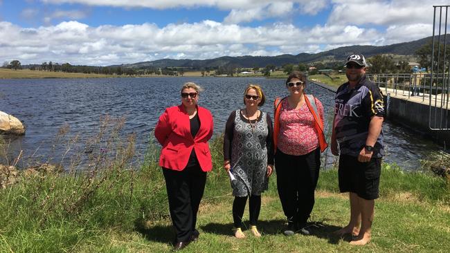 Tenterfield Shire Council staff on hand to assist with release of juvenile golden perch, including acting chief executive Kylie Smith, executive assistant Noelene Hyde, projects engineer Mel Blum and community volunteer Brett Dowd.