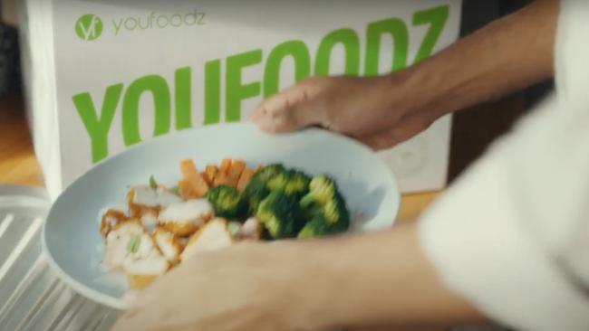 The brands in the ad are shown in various ways such as a family enjoying a YouFoodz meal and perusing a web page of The Iconic on a laptop before the kids hop on the not-for-profit meditation app Smiling Mind to wind down.