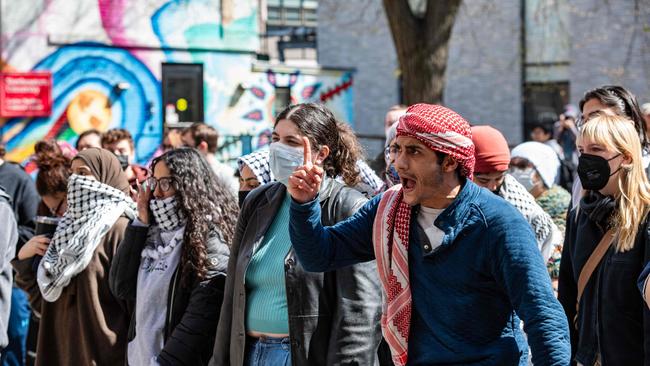 Pro-Palestinian protesters front a police barricade Northeastern University in Boston on Saturday. Picture: AFP