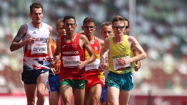 Jaryd Clifford (right) ran a gutsy race in the 5000m final.