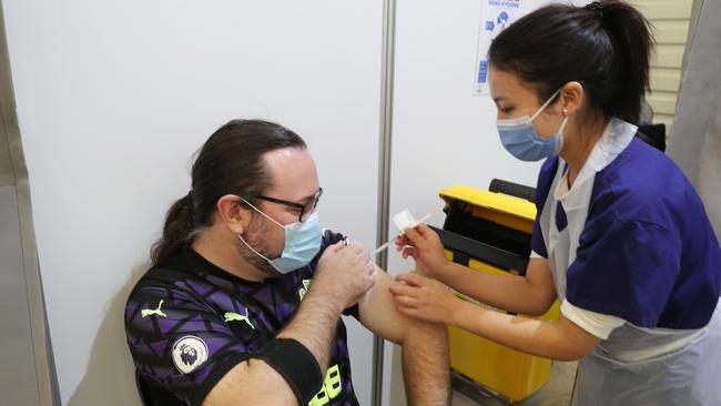 Mike Lavery gets his COVID-19 vaccination at the the vaccination centre in Melbourne Showgrounds, Flemington. Picture: NCA NewsWire / David Crosling