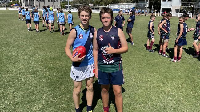 Marymount College's junior boys' Jack Hudson, left, with a Pacific Pines SHS mate.