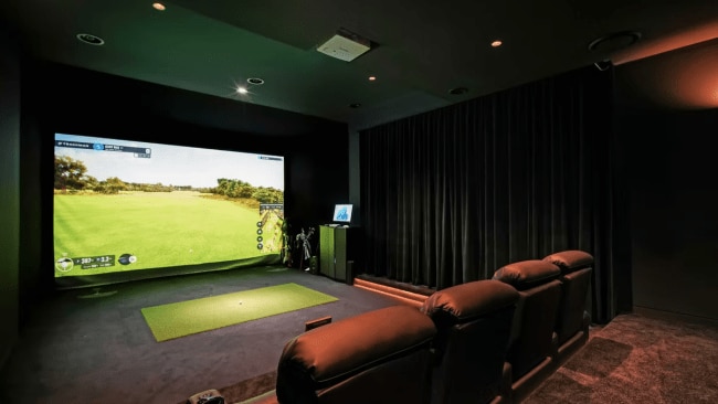 The golf simulator rivals that of multi level modern apartments. Picture: Zanetto Builders/Supplied